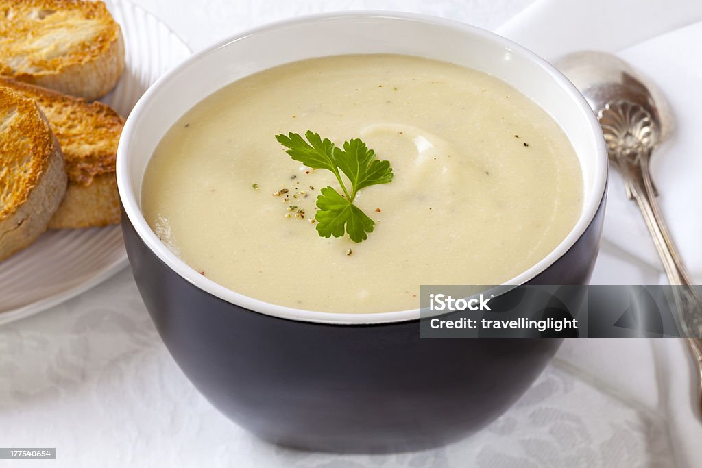 Cauliflower and Potato Soup Homemade cauliflower and potato soup with a sprinkle of gourmet peppercorns. Potato Soup Stock Photo