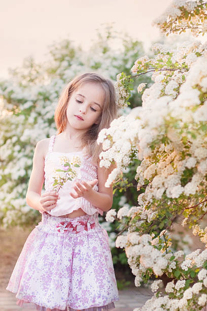 istock beautiful girl in spring garden 177541223