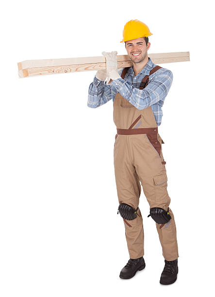istock Worker wearing hard hat and carrying timber 177541365