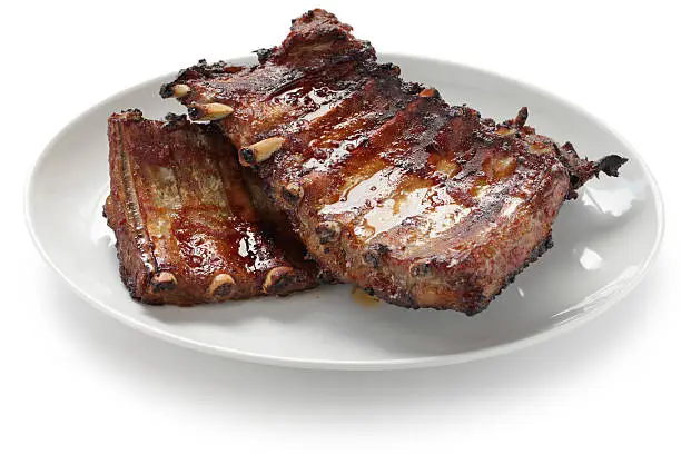 a rack of cooked pork spare ribs