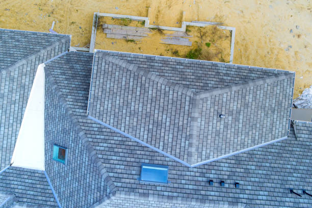 istock When constructing the newly built house, the roof is being covered with asphalt shingles as the building of the house is taking place 1775416222
