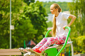 Girl doing legs exercise at outdoor gym area