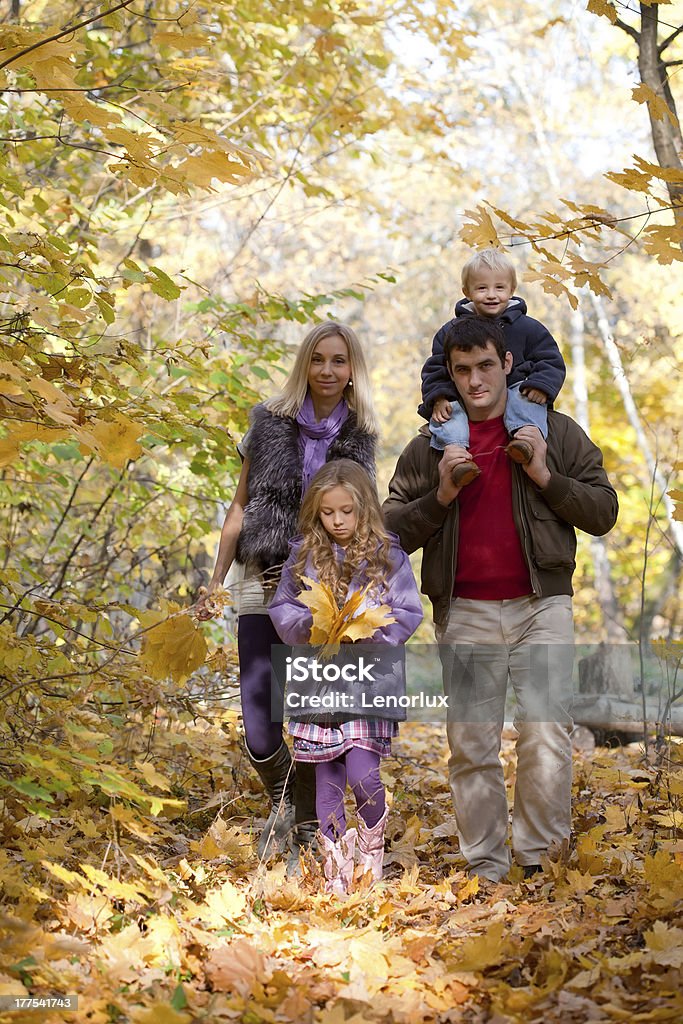 Family Enjoying Walk In Park 2-3 Years Stock Photo