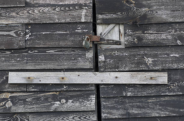 istock Padlock on old wooden door 177542329