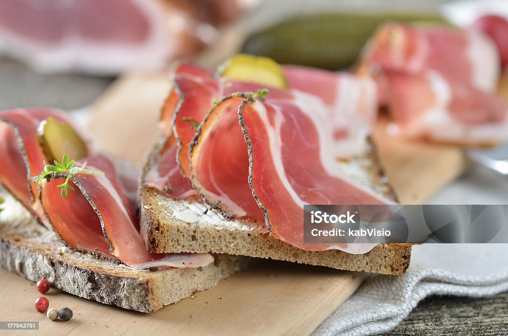 Snack with smoked bacon South Tyrolean smoked bacon on farmhouse bread Austrian Culture Stock Photo