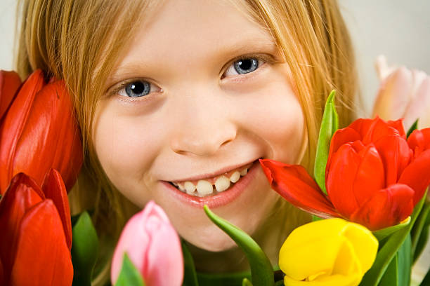 istock Girl and tulps 177542810