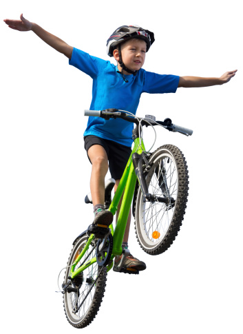 Boy flying on bicycle with swept arms like wings. Isolated on the white