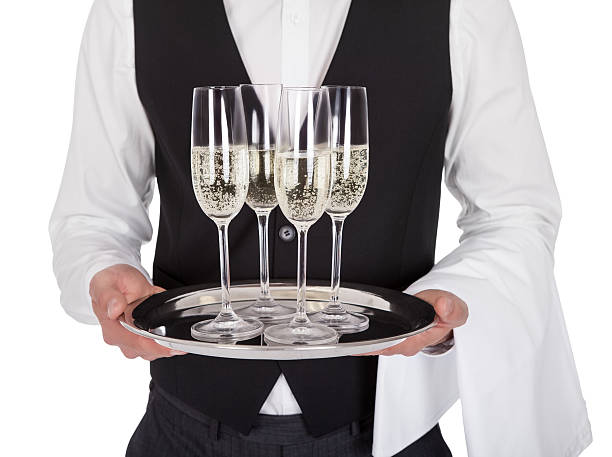 retrato de un joven alegre de mayordomo - waiter butler champagne tray fotografías e imágenes de stock