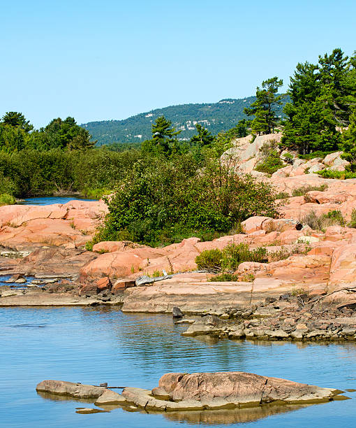 Geological formations in Killarney "White quartzite mountains and pink granite rocks near Killarney, Ontario" sandbanks ontario stock pictures, royalty-free photos & images