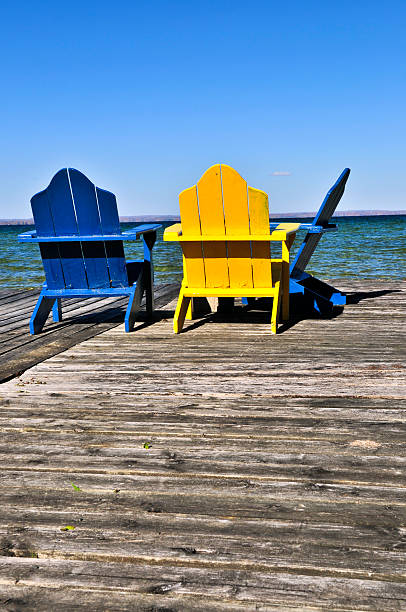 istock Chairs on wooden dock at lake 177544570