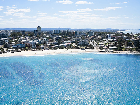 AERIAL VIEW OF THE PUMICESTONE PASSAGE IN CALOUNDRA ON THE SUNSHINE COAST IN AUSTRALIA. VIEW OF THE SAND BANKS IN THE FOREGROUND AND CALOUNDRA AND THE NORTH IN THE BACKGROUND.