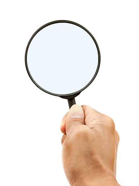 istock hand and magnifying glass on white background 177544650