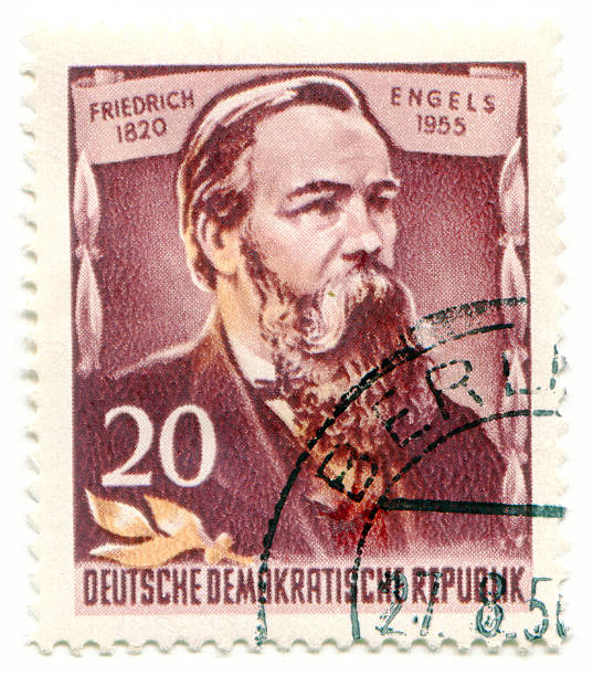 Friedrich Engels on East Germany postage stamp "Stamp printed by East germany, shows Friedrich Engels, circa 1955" friedrich engels stock pictures, royalty-free photos & images