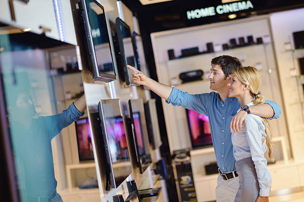 istock Young couple in an electronics store pointing at a TV 177546336