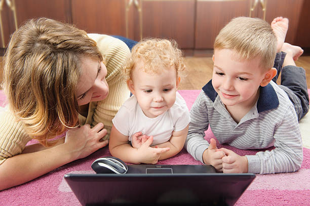 istock Young mother with her son and daughter on floor 177546384