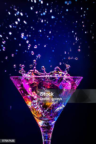 Splashing Cocktail Rich In Colors Stock Photo - Download Image Now - Martini, Cocktail, Black Background