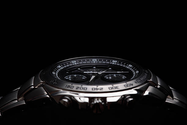 Wrist watch Wrist watch on black background tacheometer stock pictures, royalty-free photos & images