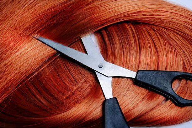 istock Red straight hair and a scissor 177548544