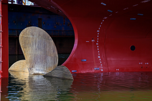 Close up of a Ship Propeller in water.