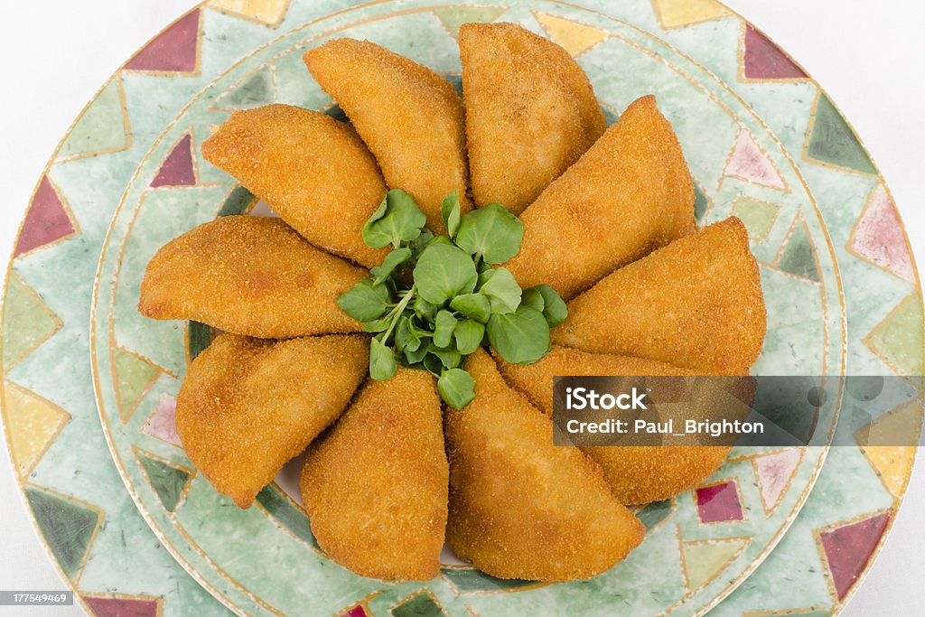 Rissole Rissole - breaded and deep fried snacks filled with shredded chicken on a colourful plate on a white background. Breadcrumbs Stock Photo