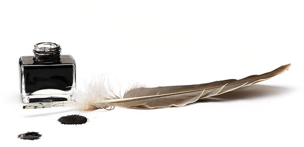 istock Feather quill with pot of black ink on white background 177549625