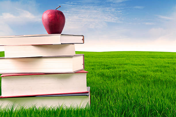 istock Books with apple outdoor 177551208