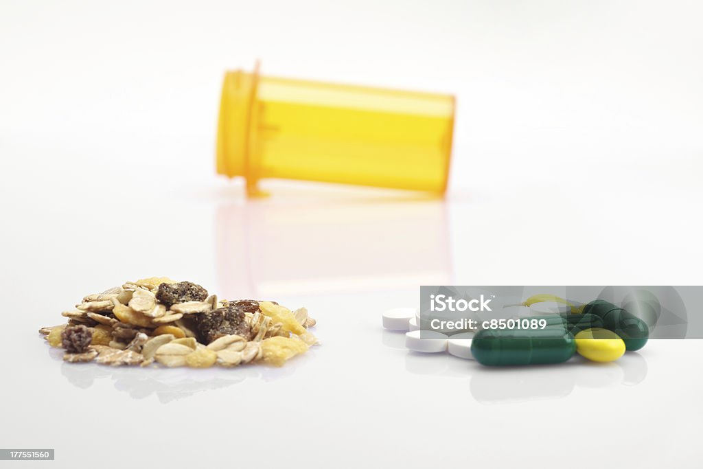 Oatmeal versus drugs Concept of health oatmeal versus medicine Beauty Stock Photo
