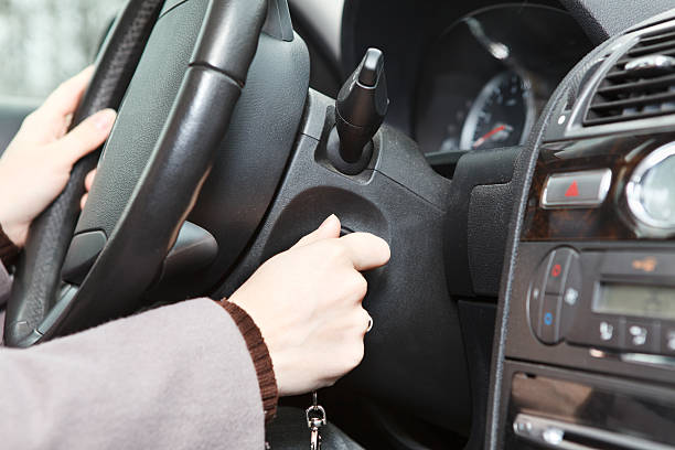 istock Female hand starting a car engine with ignition key 177551941