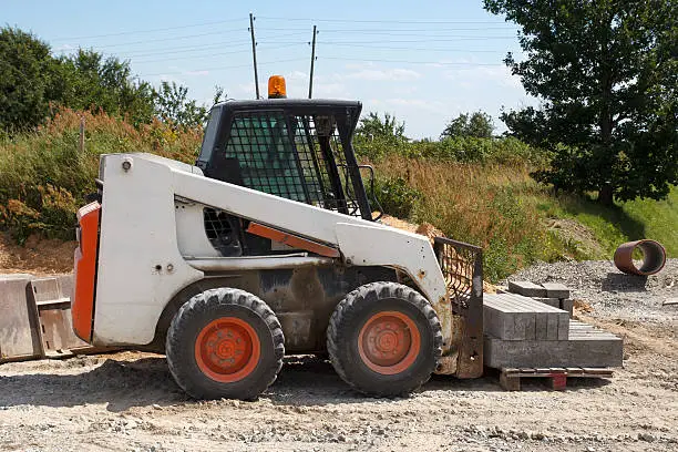 small excavator Bobcat at construction site