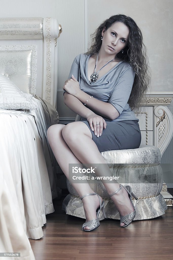 Beautiful woman in a bedroom other photos of this model: Adult Stock Photo