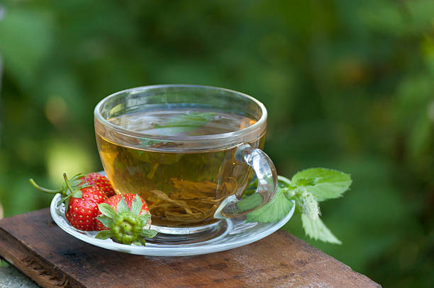 istock green mint tea with strawberry at nature background 177552843
