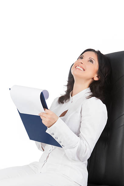 istock woman writing a doc and smiling 177553056