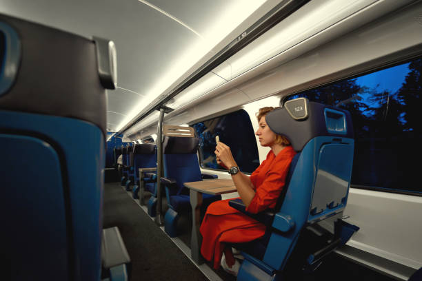 istock Public transport with woman in train on commute into city or work during evening time. Train travel and reading on mobile phone social media,  notifications, messages  or video. Copy space. 1775543247