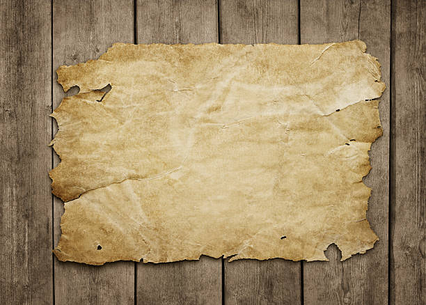 Old paper sheet at wooden background