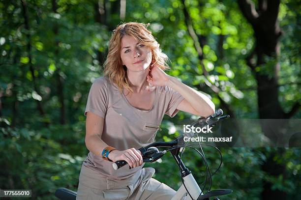 Girl With A Bicycle Stock Photo - Download Image Now - Active Lifestyle, Activity, Adult