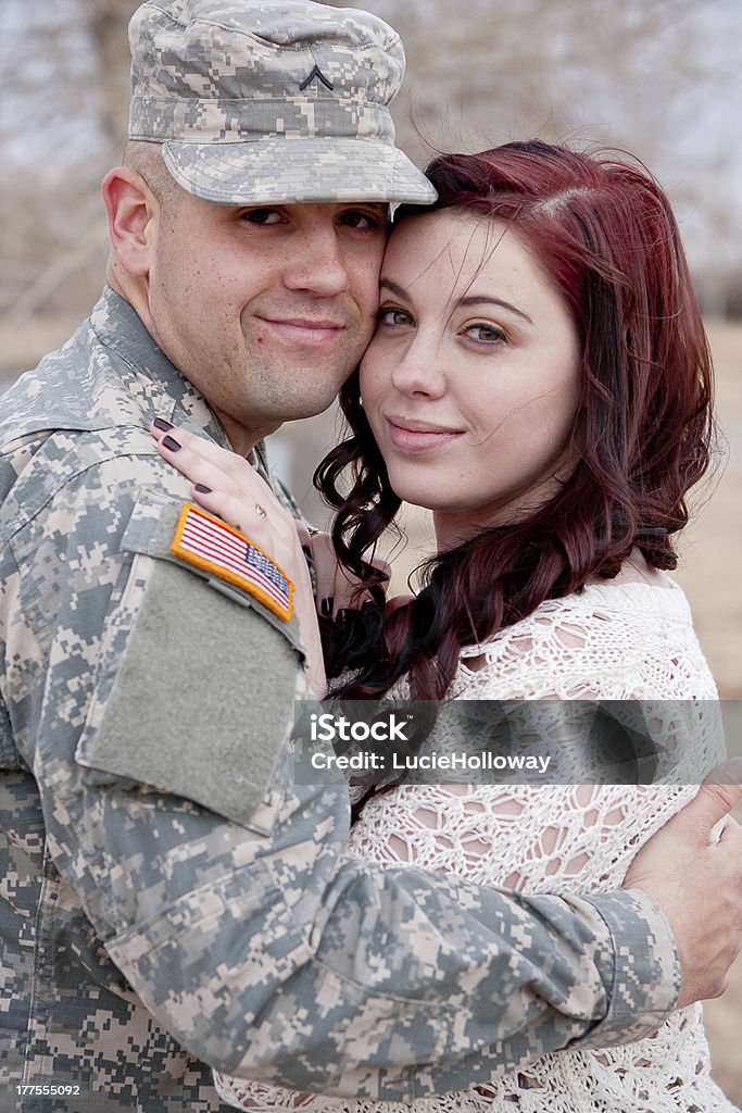 Soldier and wife Soldier and wife holding each other close. Adult Stock Photo