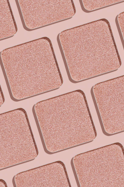 istock Minimal pattern eye shadow glitter pink swatches with shadow, monochrome photo as background, refill compact eyeshadow, shiny colored powder fo makeup, square shape metal pack, cosmetic texture 1775552716