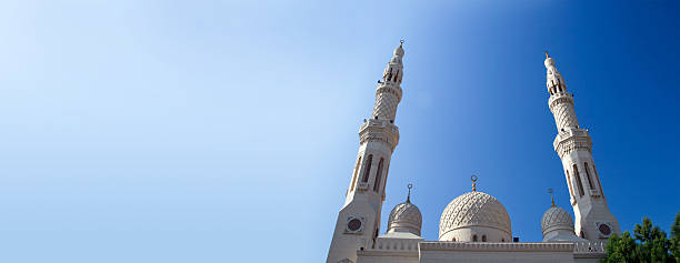 Salalah, Dhofar Governorate, Oman: Al-Jami Mosque of the Al-Rawas tribe (Friday Mosque) - dome covered in tiles in a beautiful shade of green, with golden decoration, finial (alam) with spheres and crescent - Al Jama'a Square.