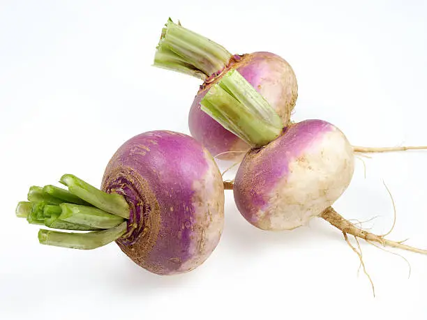 Three turnips on white background.