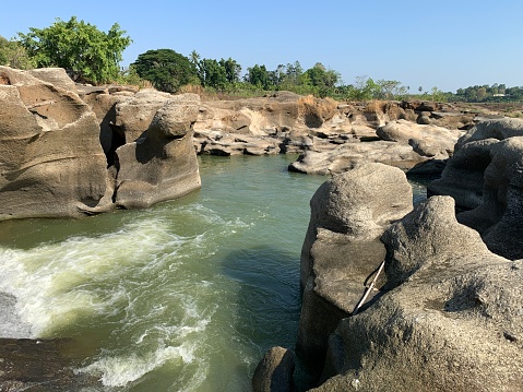 The view of the water in the dam during the dry season with its rocks is very beautiful