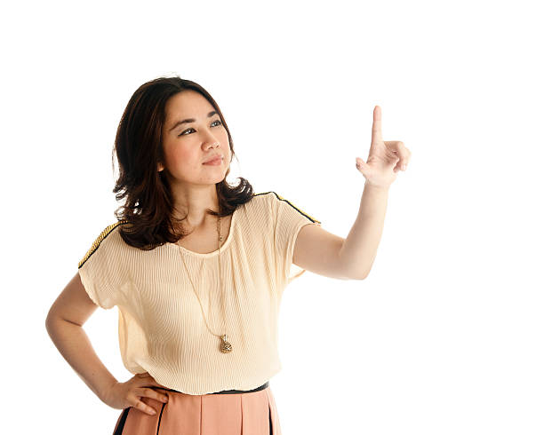 istock woman pointing at copy space 177556373