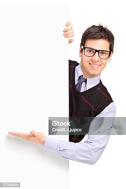 Smiling Handsome Male Posing Behind A Panel Stock Photo - Download Image Now - Behind, Males, Portrait