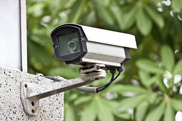 security camera security camera on wall in public space shooting guard stock pictures, royalty-free photos & images