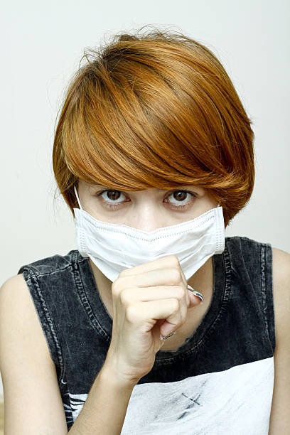 istock woman wearing protective mask 177557096