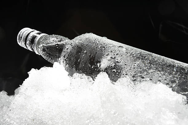 Close up view of the bottle in ice stock photo