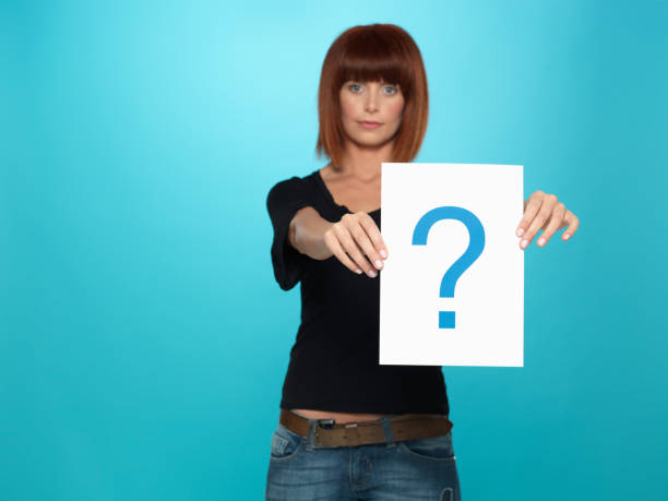 istock pretty young woman showing a question mark 177558034