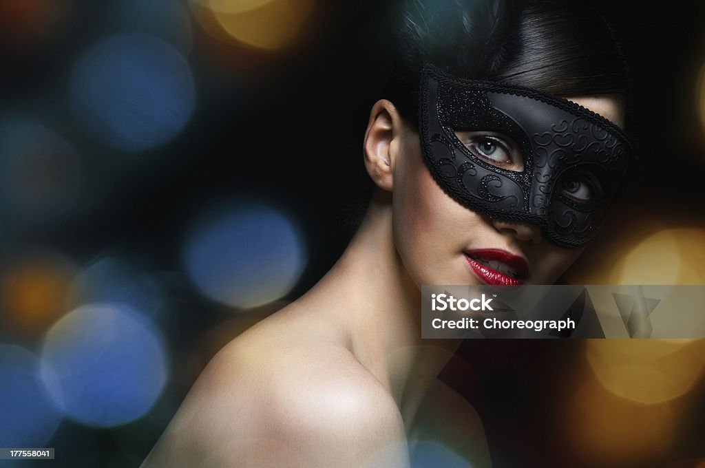 masquerade mask cute girl in masquerade mask Adult Stock Photo