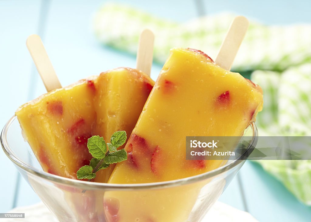 Ice Cream Orange-Mango-Peach Ice Cream with Strawberry Flavored Ice Stock Photo