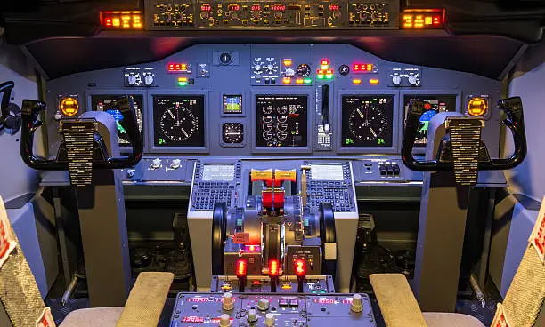 "Inside an homemade flight simulator, all lights on, ready for takeoff."
