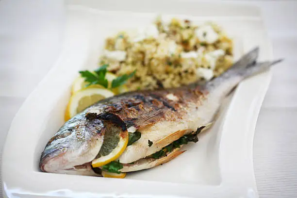 Photo of Sea bream grilled with lemons and parsley